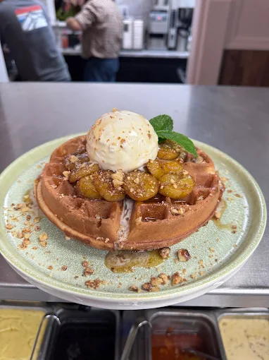 Belgian waffle with caramelized bananas and ice cream