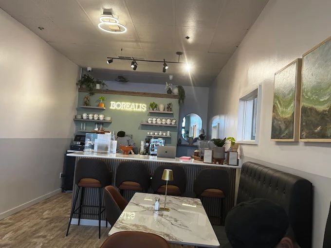 Inside the Borealis dining room with the neon sign above the espresso bar